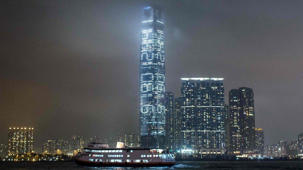 In this picture taken at night on 19 May 2016 from across Victoria Harbour, a series of a numbers is projected onto the side of the International Commerce Centre, Hong Kong's tallest building.