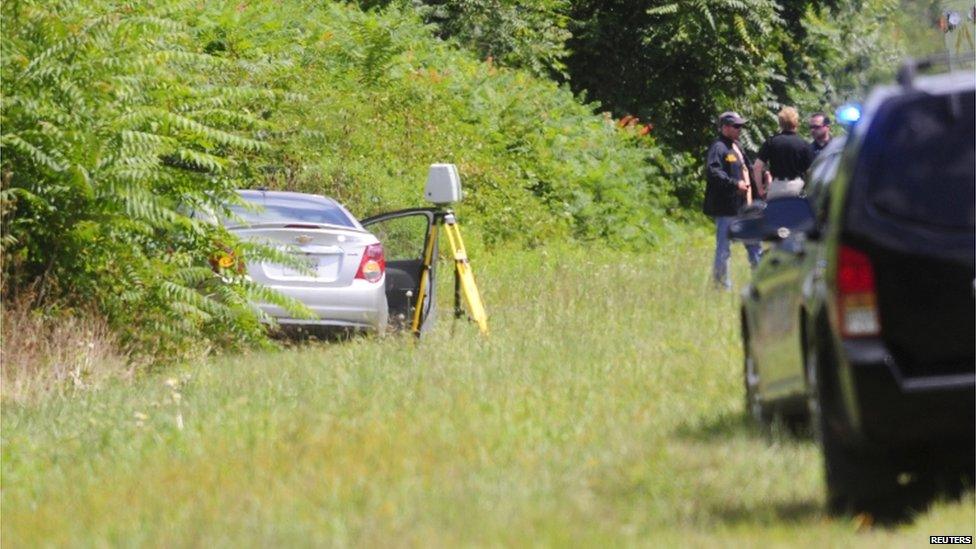 The car of suspected gunman Vester L Flanagan, also known as Bryce Williams, is seen off Highway I-66 in Fauquier County, Virginia on 26 August 2015.