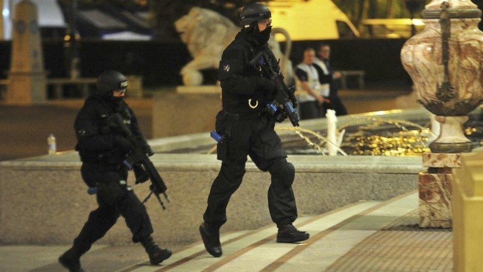 Armed officers take part in a training drill simulating an armed attack