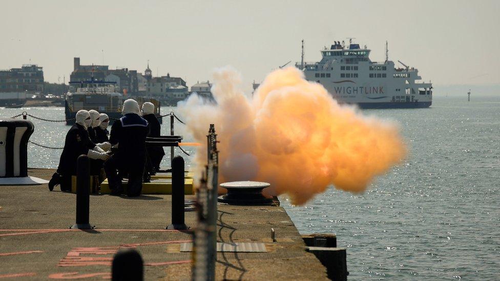 A 21-gun salute being undertaken in Portsmouth