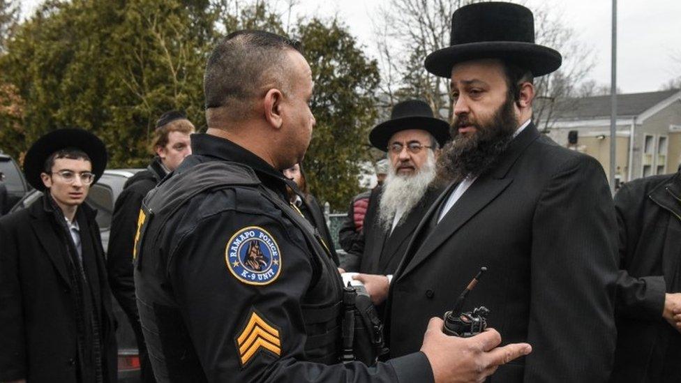 Men outside rabbi's house