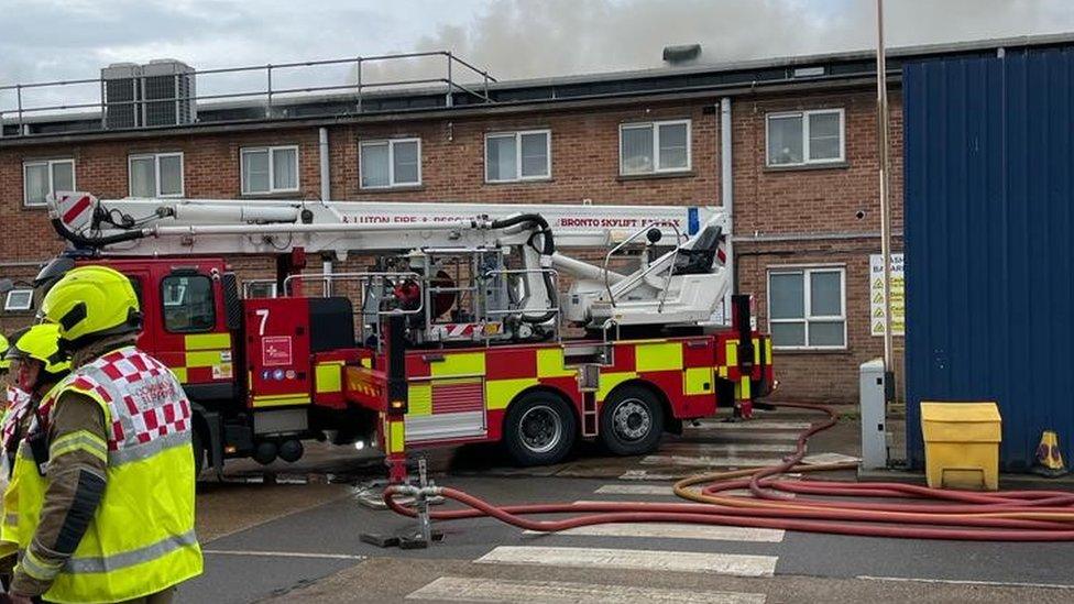 Firefighters at the Luton waste depot in Kingsbury