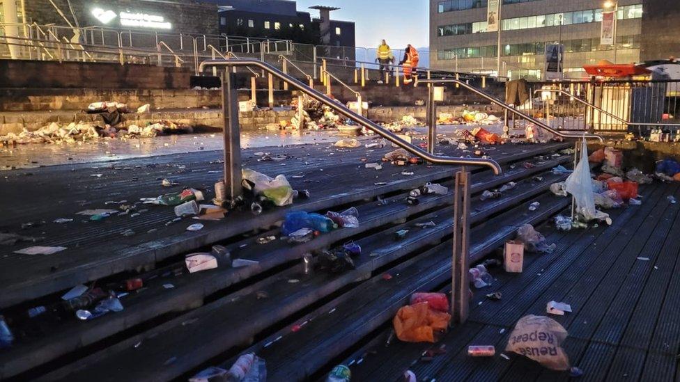 Discarded beer bottles and other rubbish at Cardiff Bay