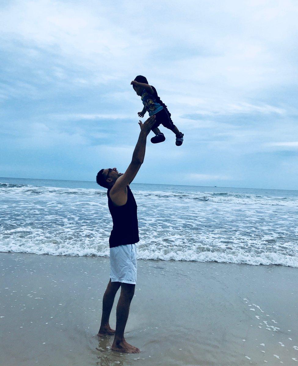 Father and son on the beach