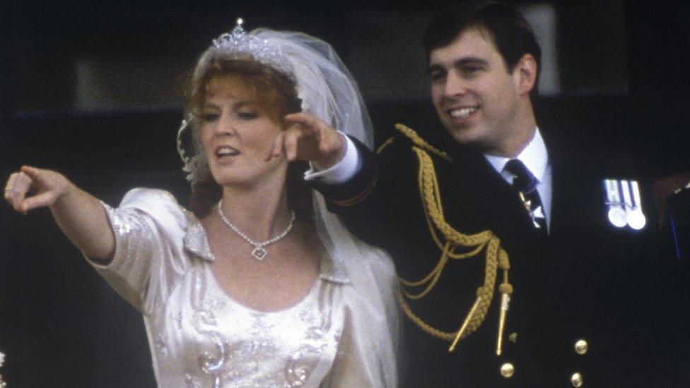 Sarah Ferguson, Duchess of York and Prince Andrew, the Duke of York point to the watching crowd on their wedding day