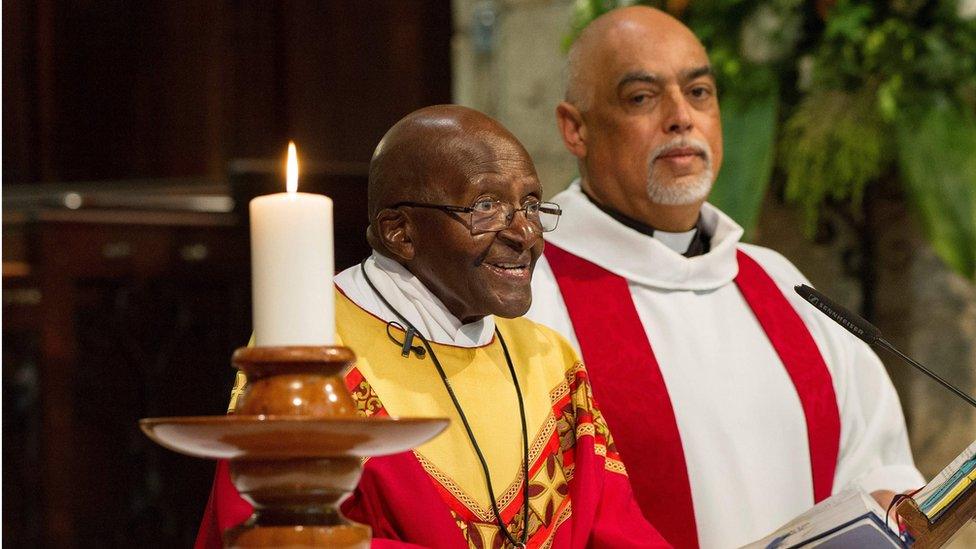 Former archbishop Desmond Tutu celebrates a mass with Dean Michael Weeder to mark his 85th birthday
