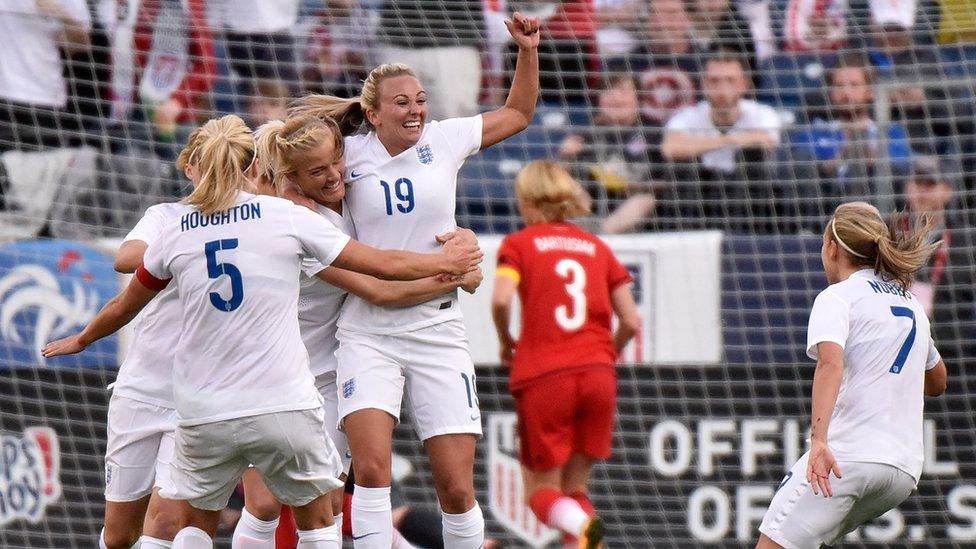 Toni Duggan celebrates an England goal with teammates