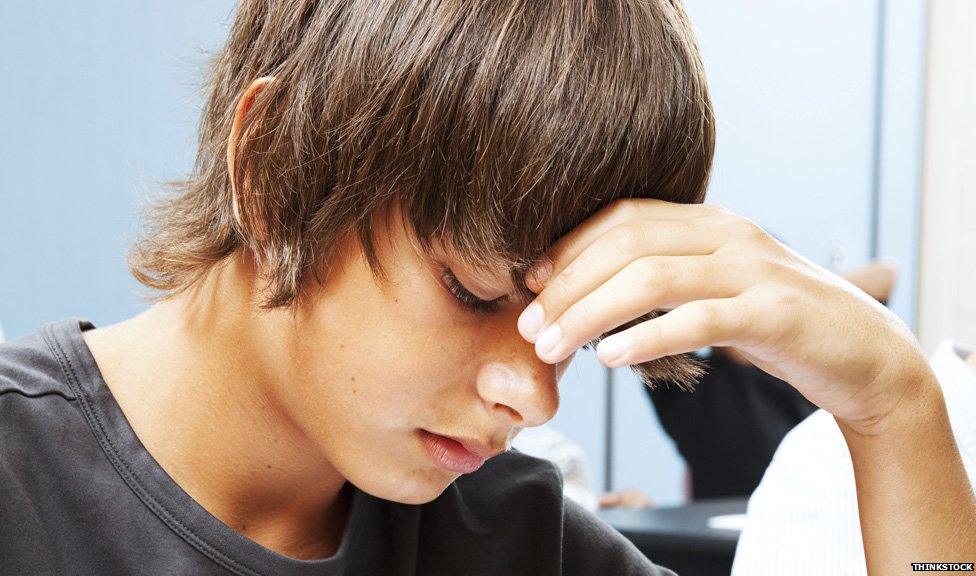 Young man sitting an exam