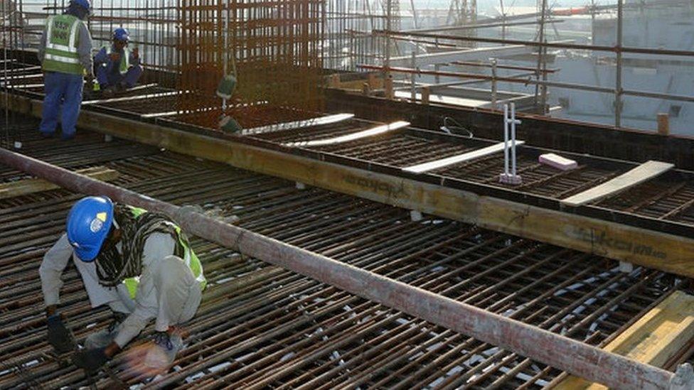 Workers at Khalifa Internatoinal Stadium (file photo)