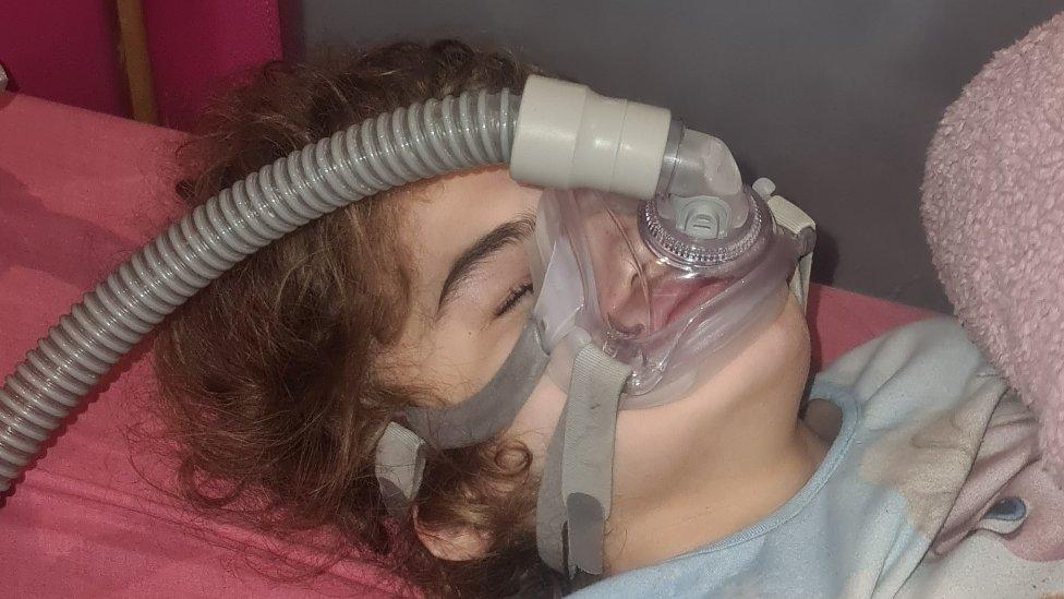 16-year-old Josselin pictured using a ventilator