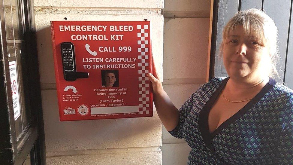 Julie Taylor with a bleed control kit installed outside a pub