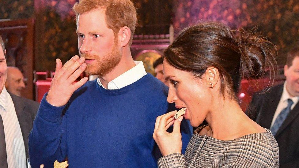 Prince Harry and Meghan Markle enjoy a Welsh cake