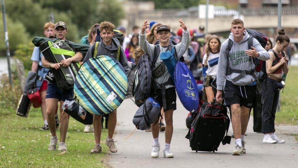 Group of teenagers with tents