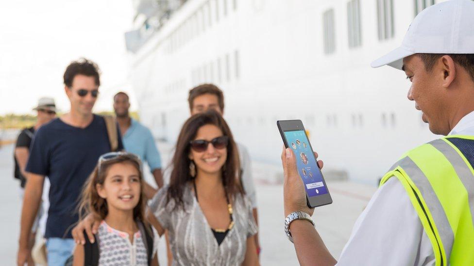 Passengers arriving at the ship