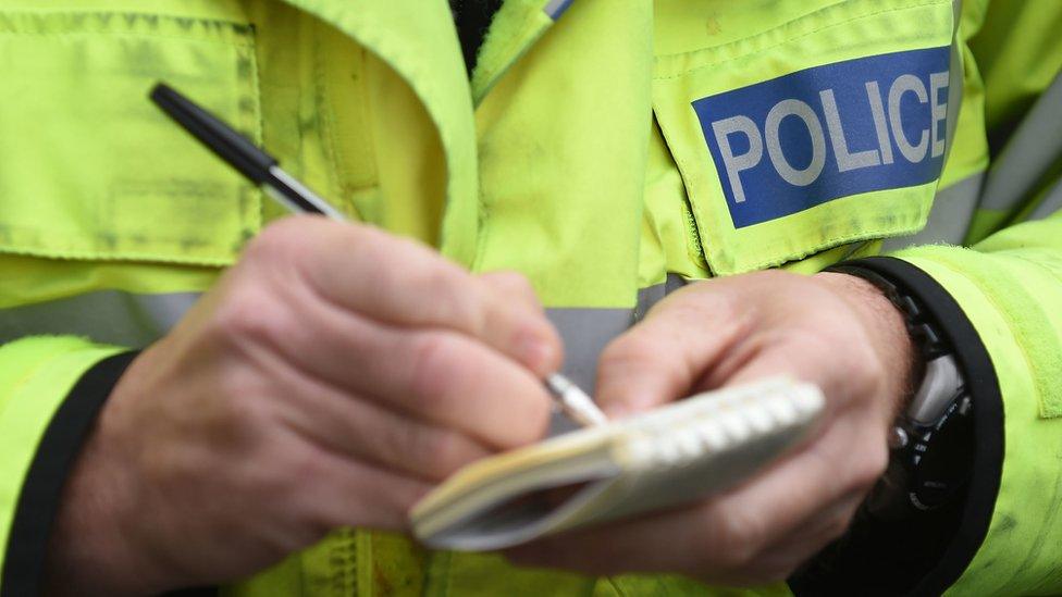 Policeman holding notebook