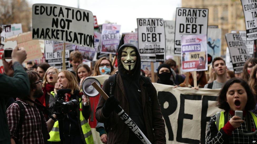 Students take part in a protest calling for the abolition of tuition fees and an end to student debt in Westminster,