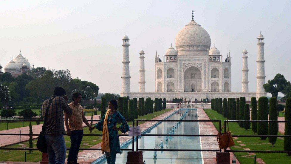 Indian tourists visit the Taj Mahal in Agra, Uttar Pradesh, India, 21 September 2020, The Taj Mahal reopened with increased safety measures after it was closed down by the authorities for six months amid the COVID-19 pandemic