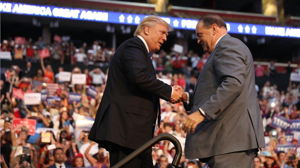 Mick Huckabee and Donald Trump shaking hands onstage at Fort Lauderdale, 10 August 2016