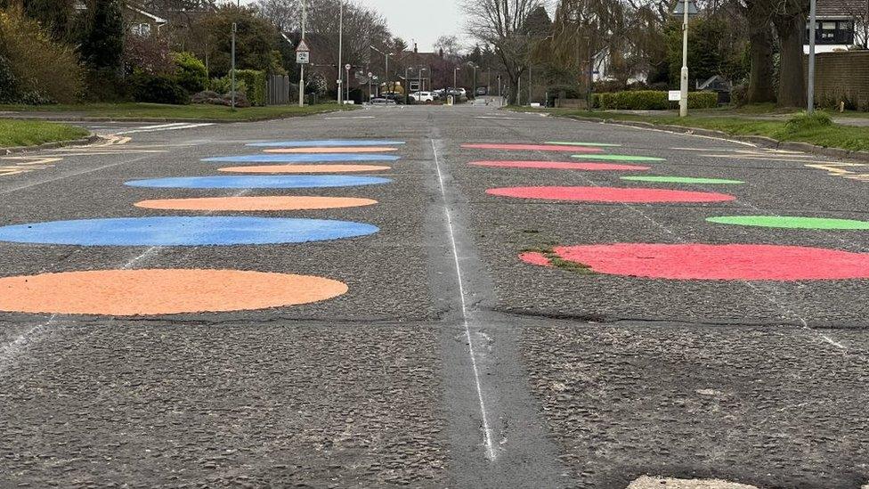 Spots on a road near a school