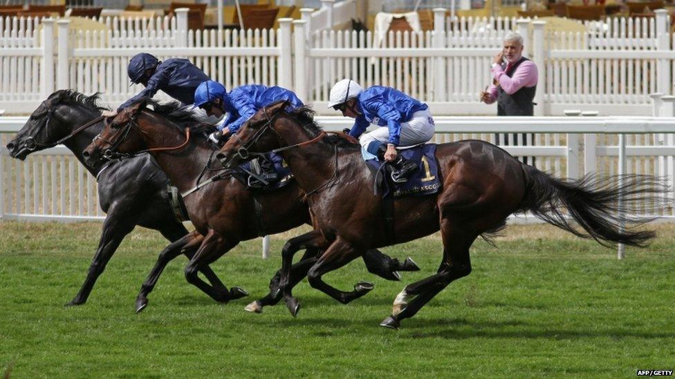 Jockey Ryan Moore on Caravaggio (L) wins the Commonwealth Cup ahead of second placed, Adam Kirby on Harry Angel (C) and third placed, William Buick on Blue Point (R) on the fourth day of the Royal Ascot horse racing meet