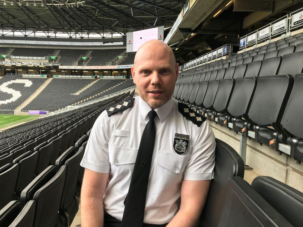 Ch Insp Euan Livingstone of Thames Valley Police sitting inside MK stadium.