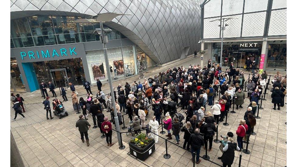 Shoppers queuing to get into a new Primark store