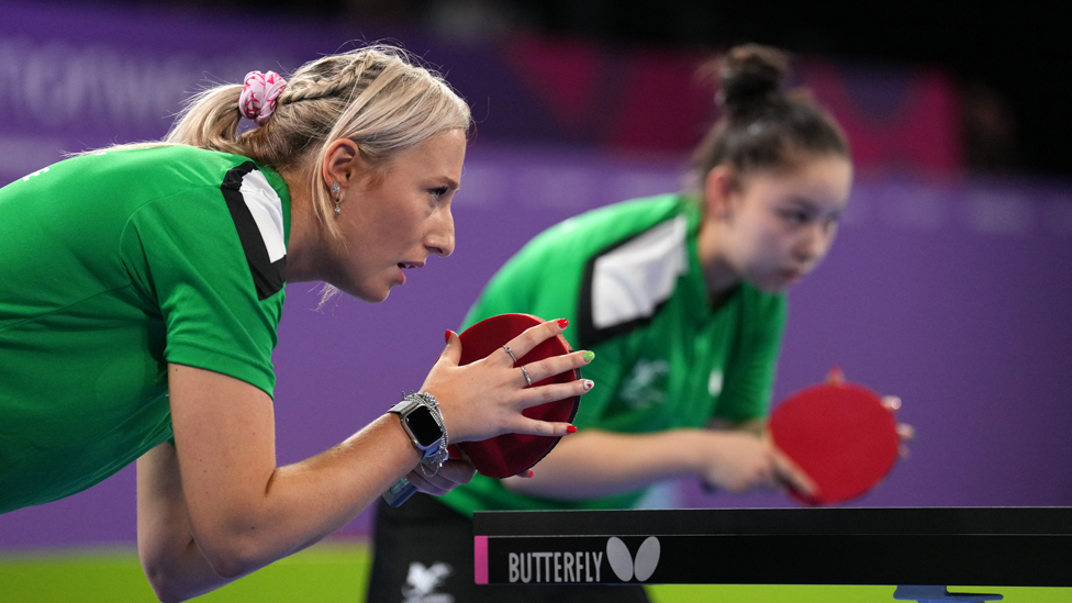 Charlotte Carey and Anna Hursey playing table tennis