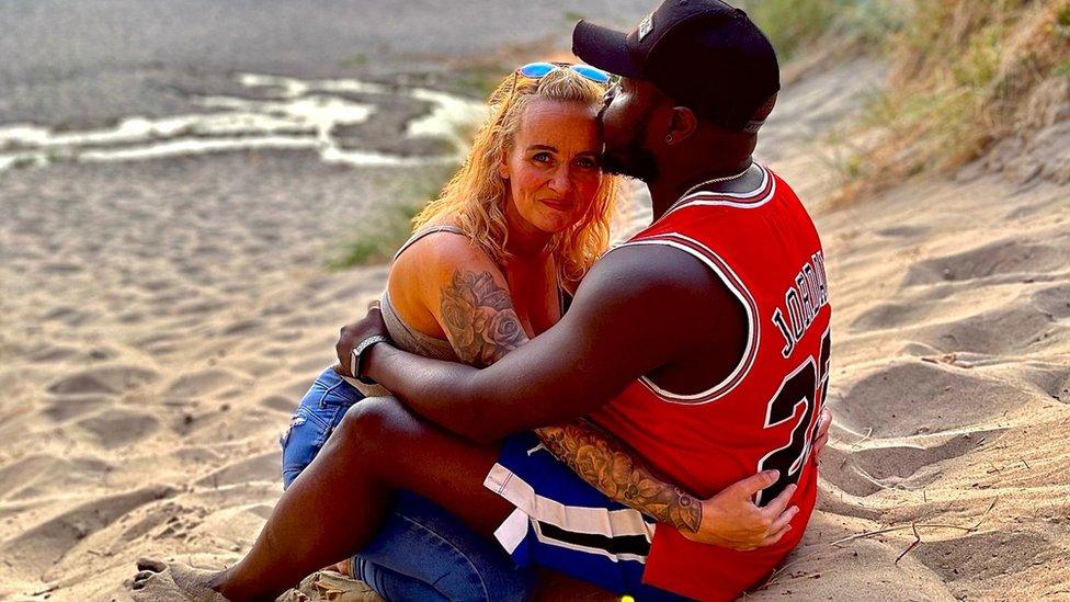 Medwen and Lamin on a beach in Gambia