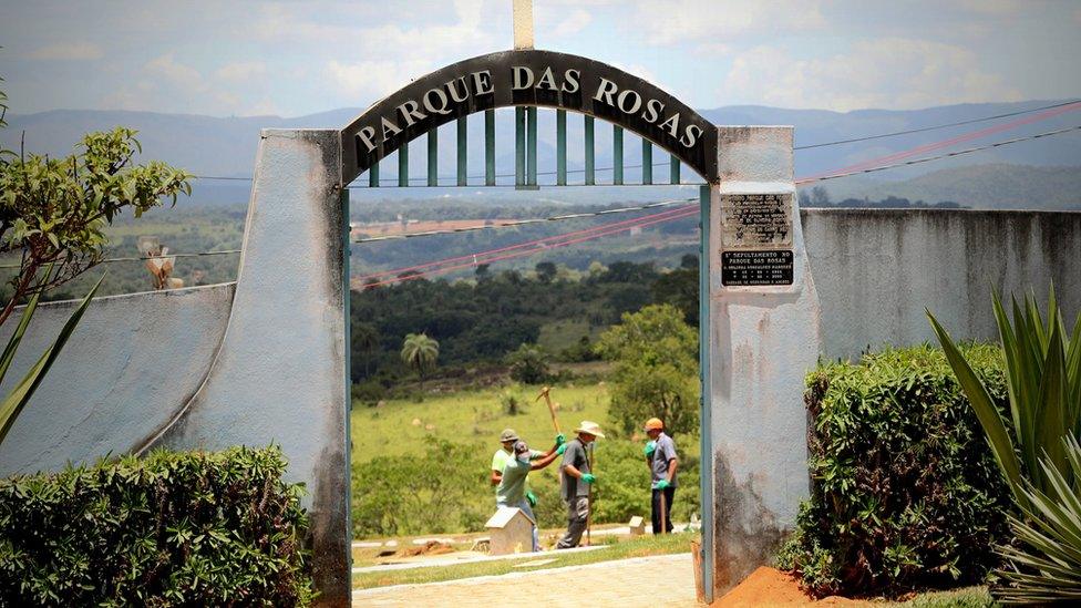 Workers dig pits to bury the victims of Vale"s dam accident, at the Parque das Rosas cemetery in Brumadinho,