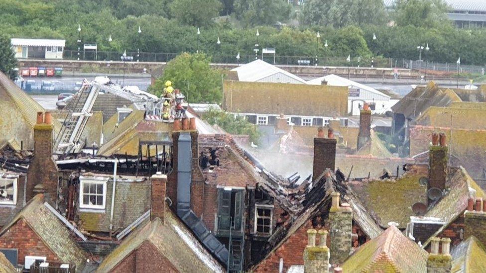 Firefighters on an aerial platform