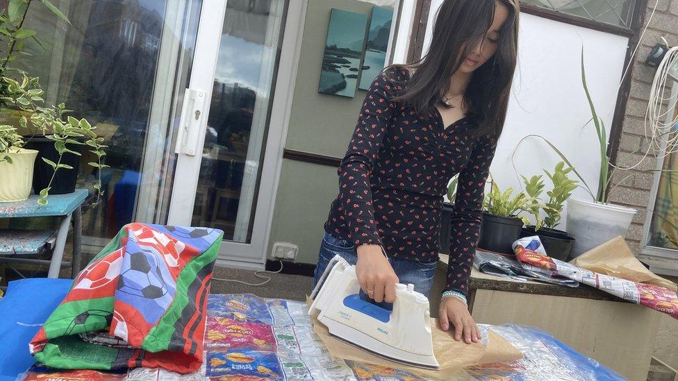 Alyssa ironing her crisp packets