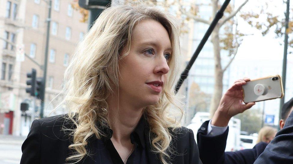 Elizabeth Holmes walks to court