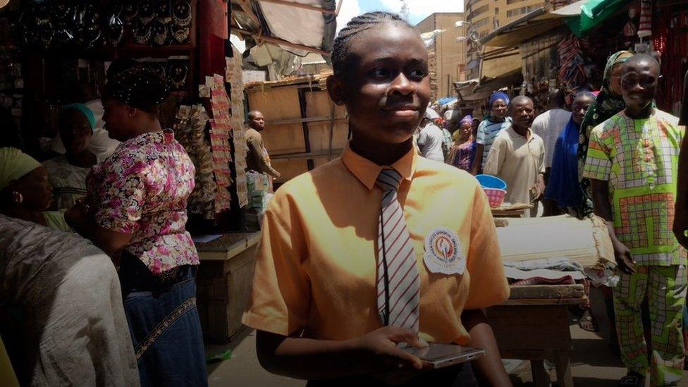 Tomisin in a market in Ikeja