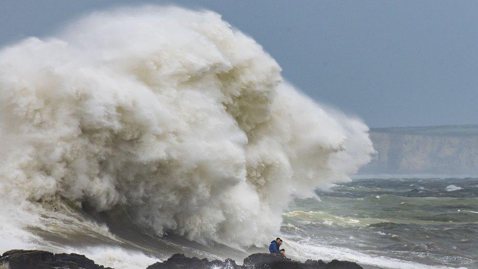 Wave crashing over rocks