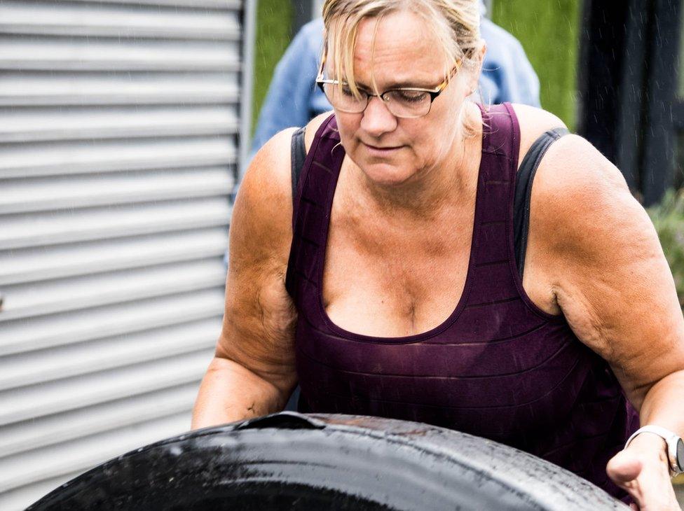 Vanessa Rhodes flipping a tyre