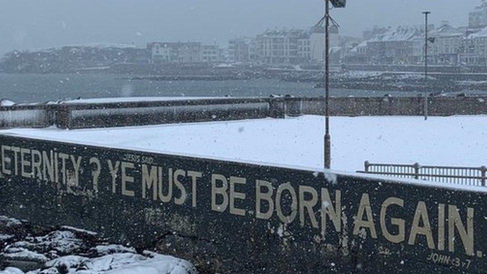 The words "Eternity? Ye must be born again" painted on the seawall in Portstewart