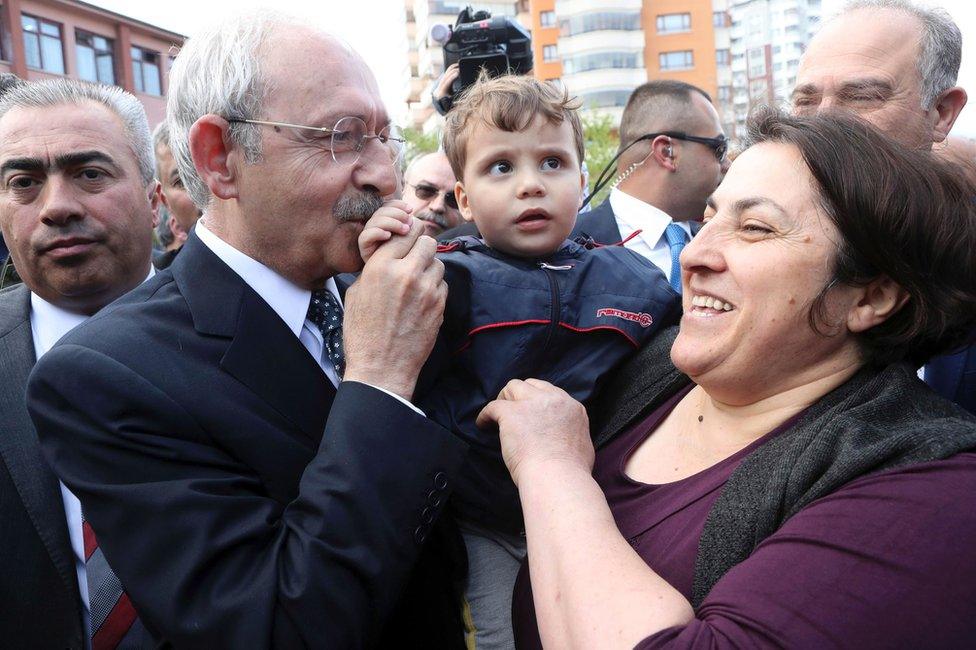 The leader of Turkey's main opposition Republican People"s Party, Kemal Kilicdaroglu, is greeted by supporters outside a polling station where he voted in the constitutional referendum in Ankara, 16 April