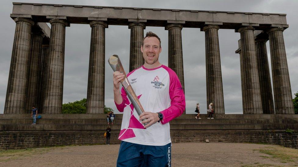 Baton bearer Scott Riddell on Calton Hill