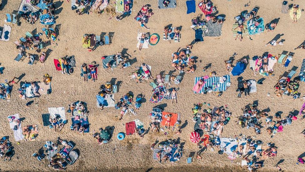 crowded beach during heatwave