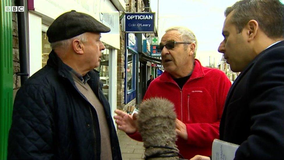 Two men arguing about Brexit in the street