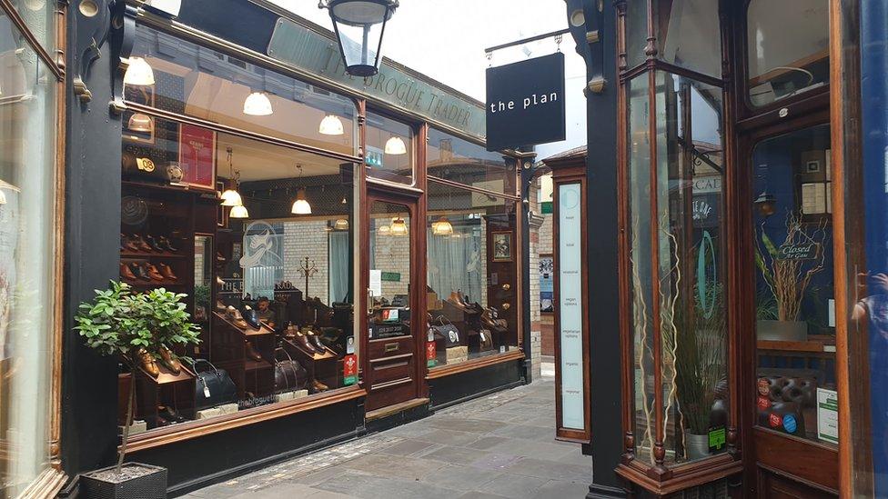 Two shops in the centre of the Morgan arcade