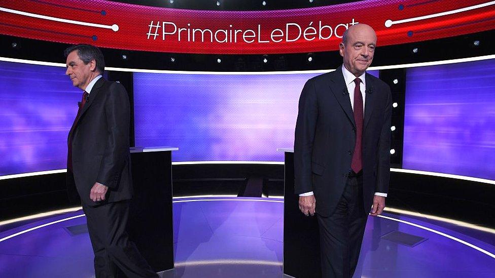 The two finalists in France's conservative presidential primary, Francois Fillon (L) and Alain Juppe, prior to taking part in the first televised debate between the two remaining candidates for the right-wing Republicans party primaries in Paris on 24 November 2016