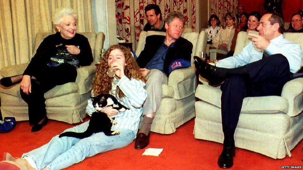 That perm... Chelsea Clinton and her cat Socks, her dad, Bill, and other guests watch the Super Bowl in 1993