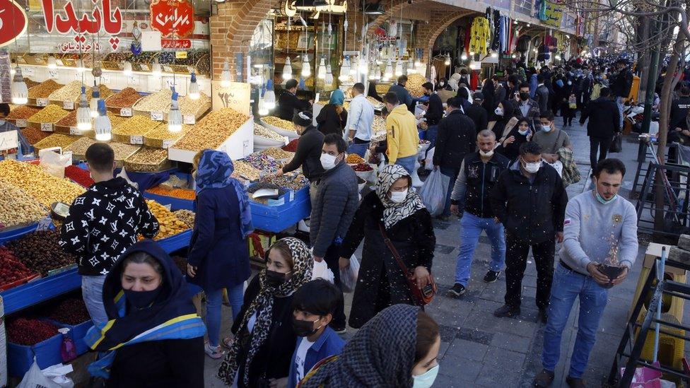 Iranians go shopping at a grand bazaar in Tehran, Iran (2 March 2021)