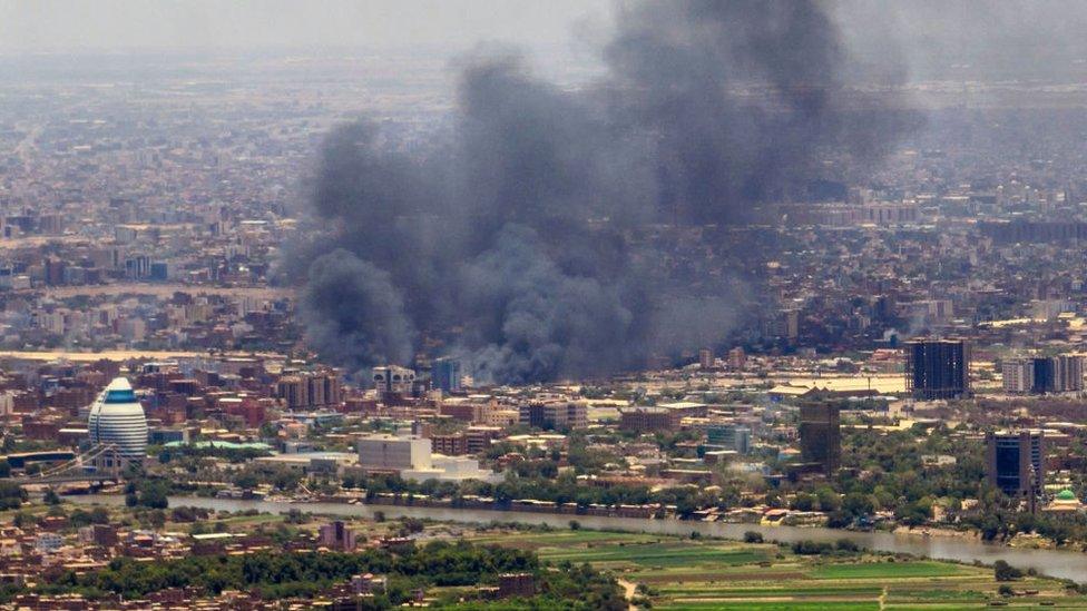 Smoke rises over Khartoum