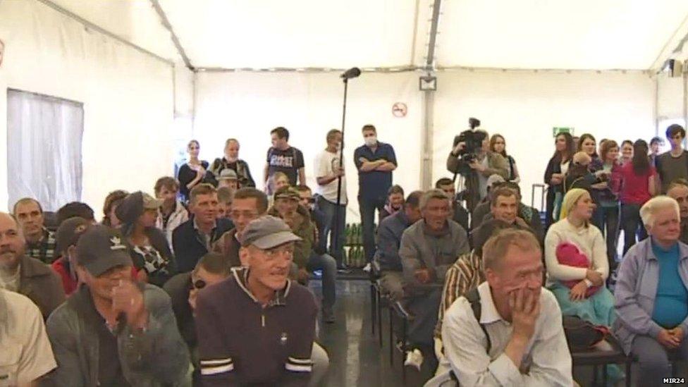 Moscow homeless watch a film at a makeshift charity cinema