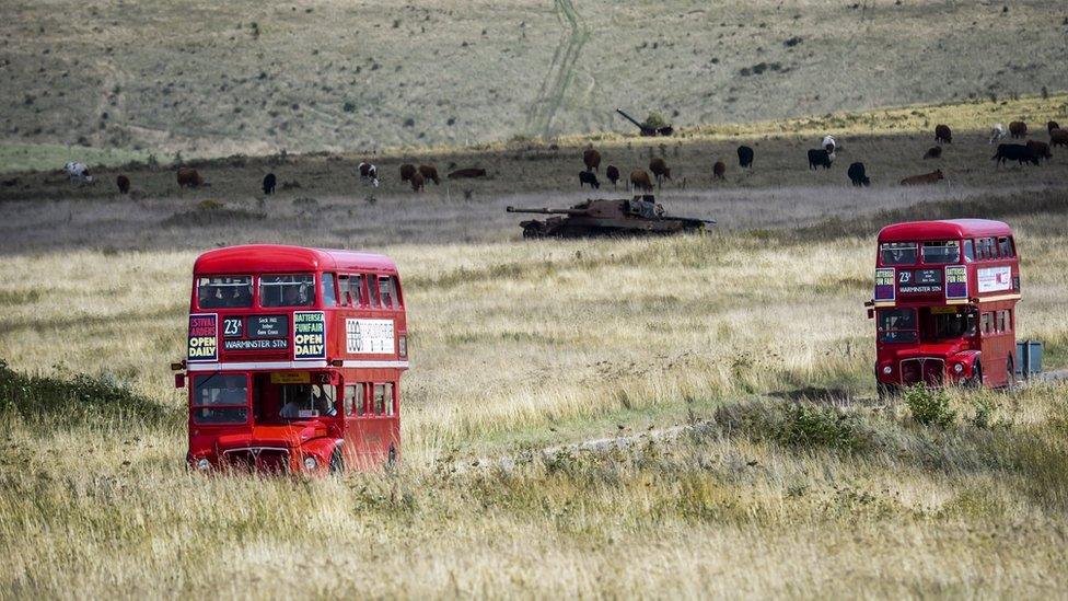 Routemaster buses on their way to the deserted village of Imber on Salisbury Plain, Wiltshire