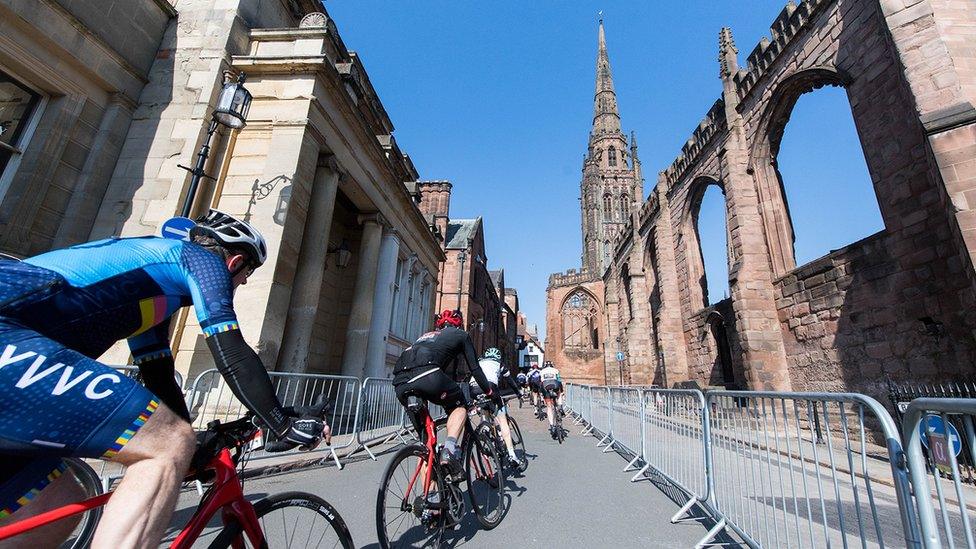 Cyclists passing through Coventry