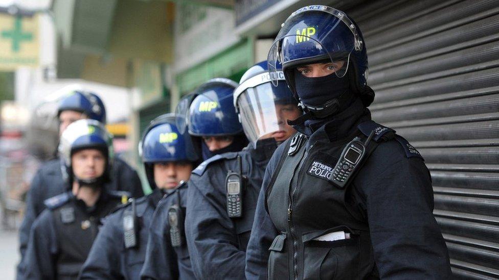 Police officers in protective gear