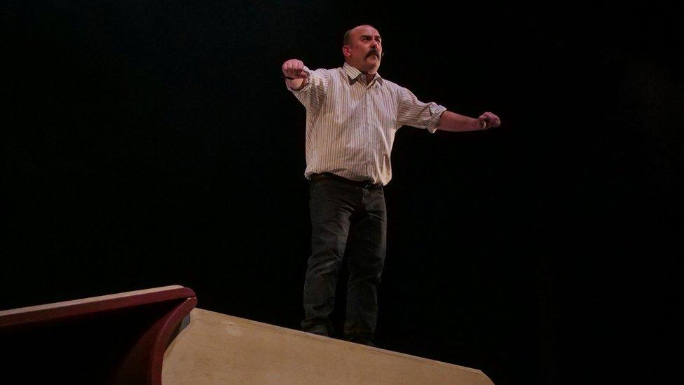 Paul Garret as David Ervine on stage